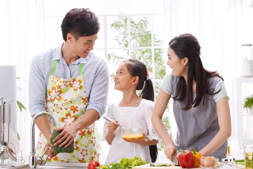 A family preparing a meal together in a kitchen