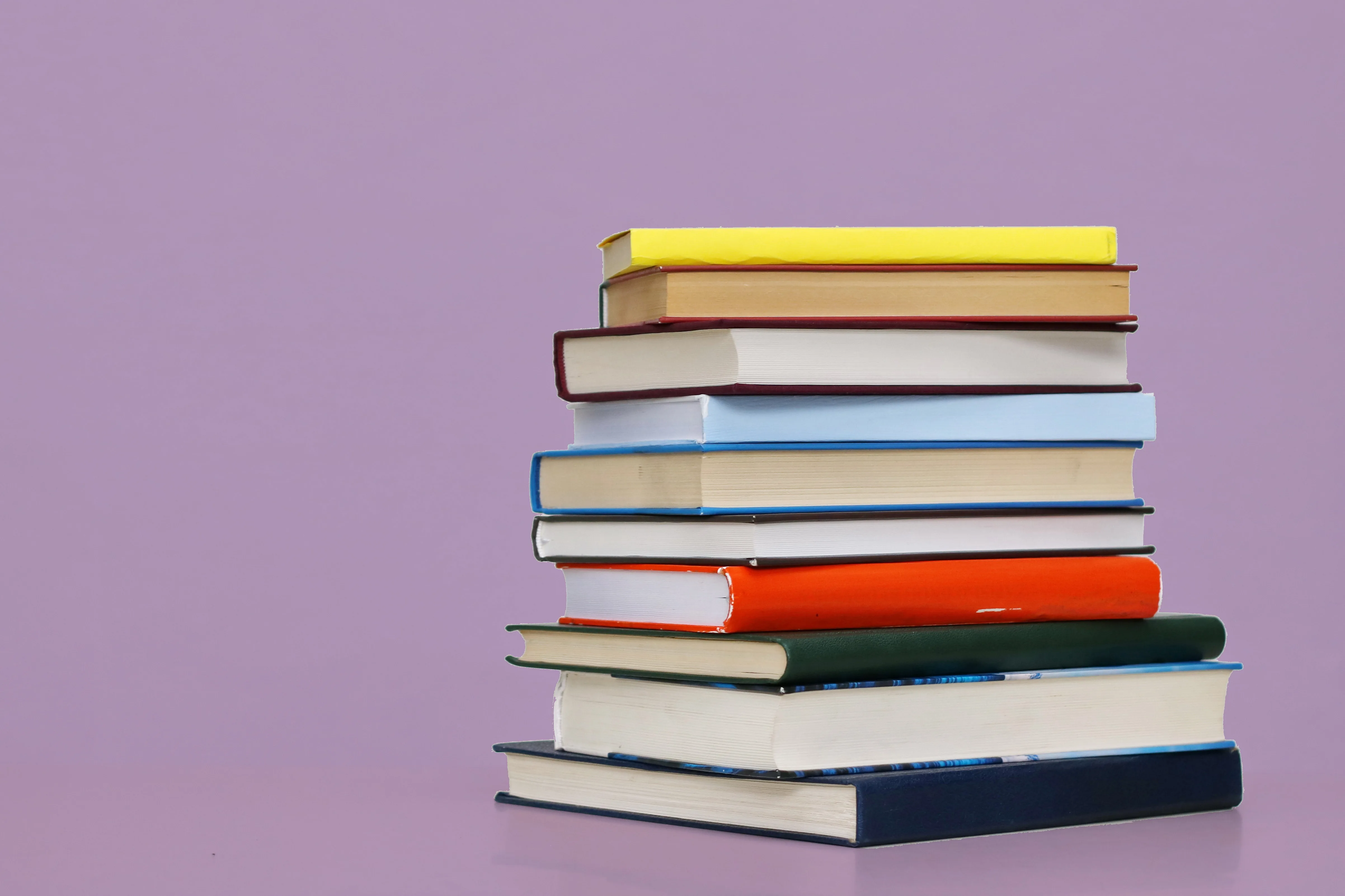 A stack of hardback books