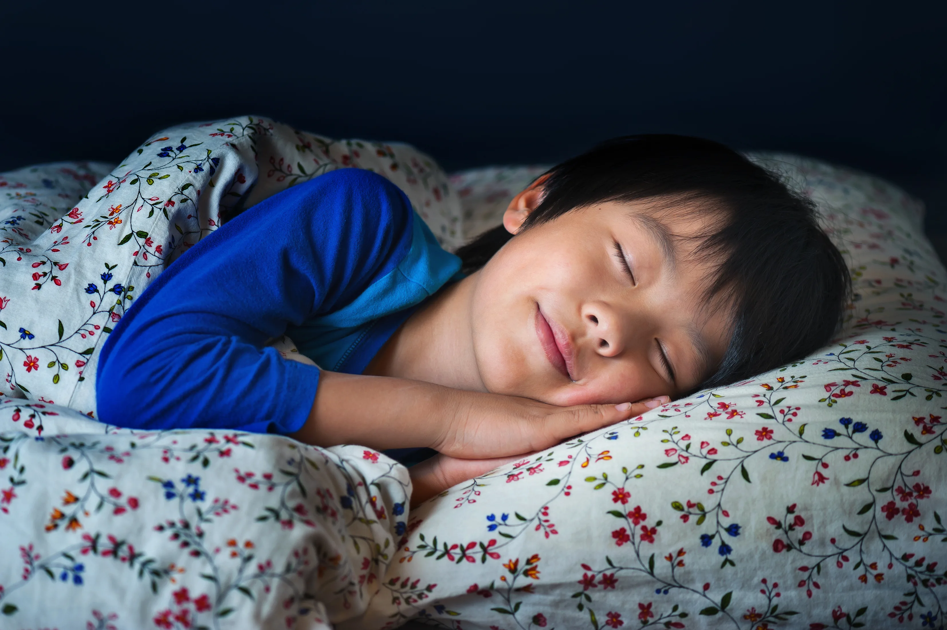 A child asleep in bed