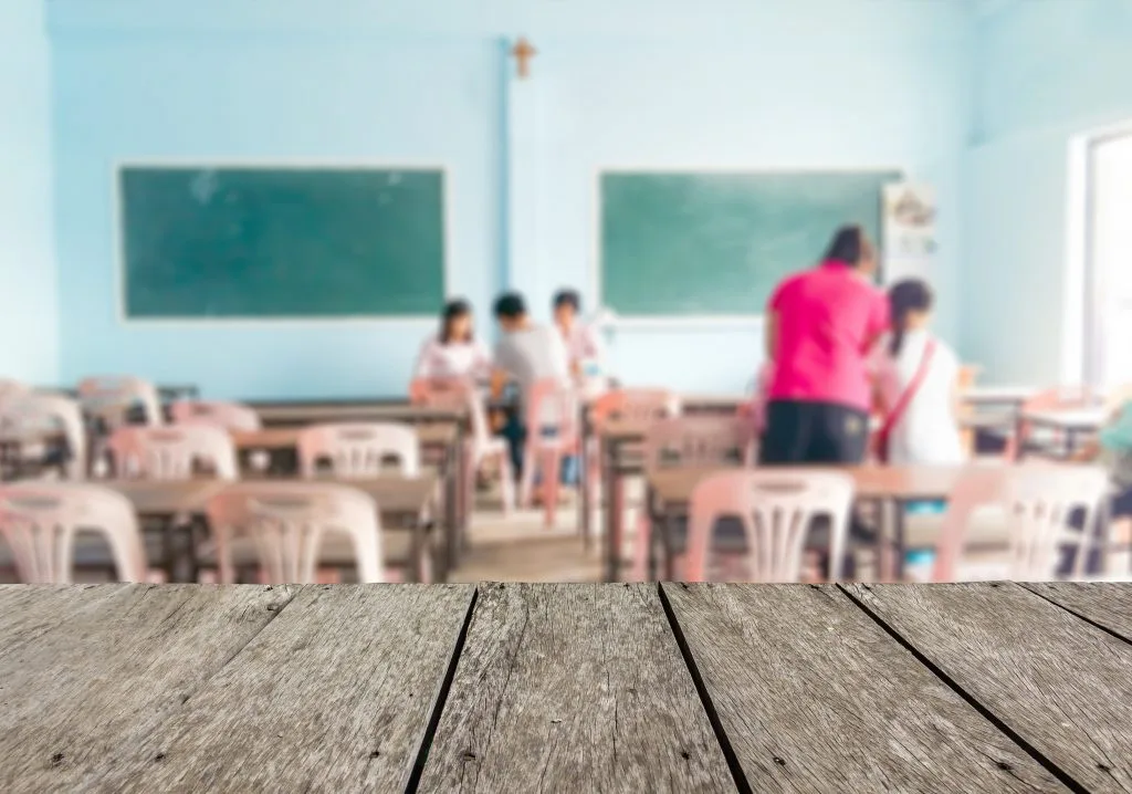 A classroom set out with small tables and chairs