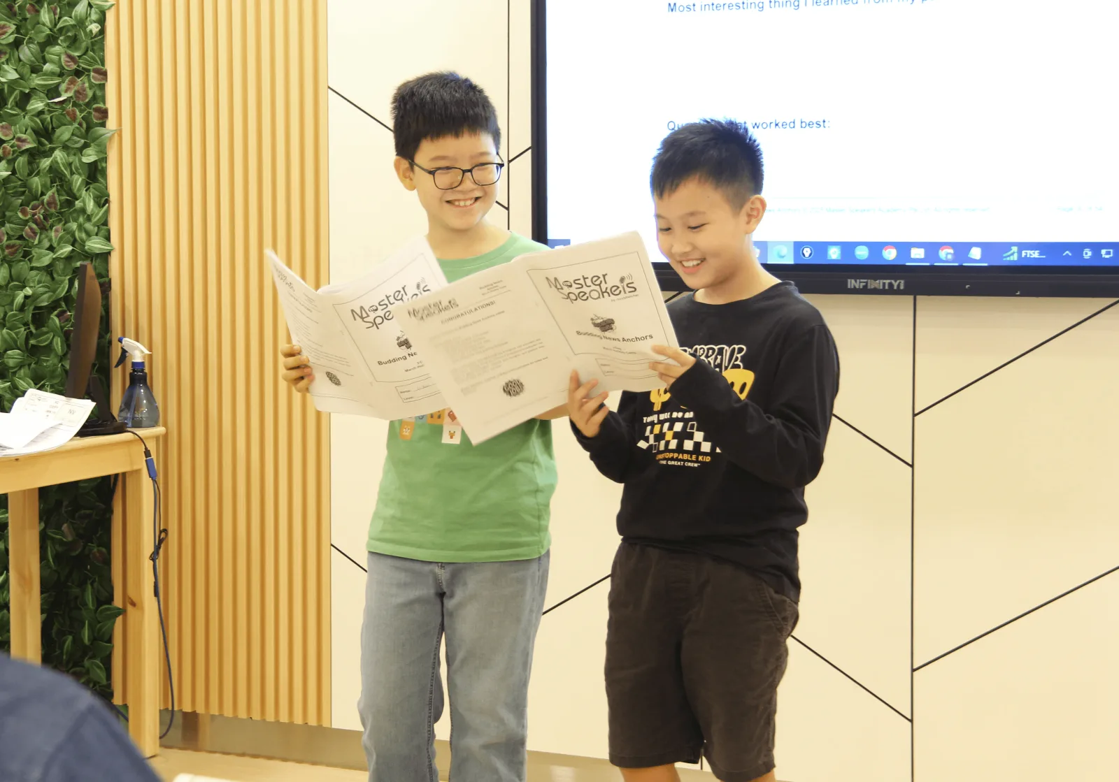 Students at a Mind Stretcher holiday programme showing their work to the room